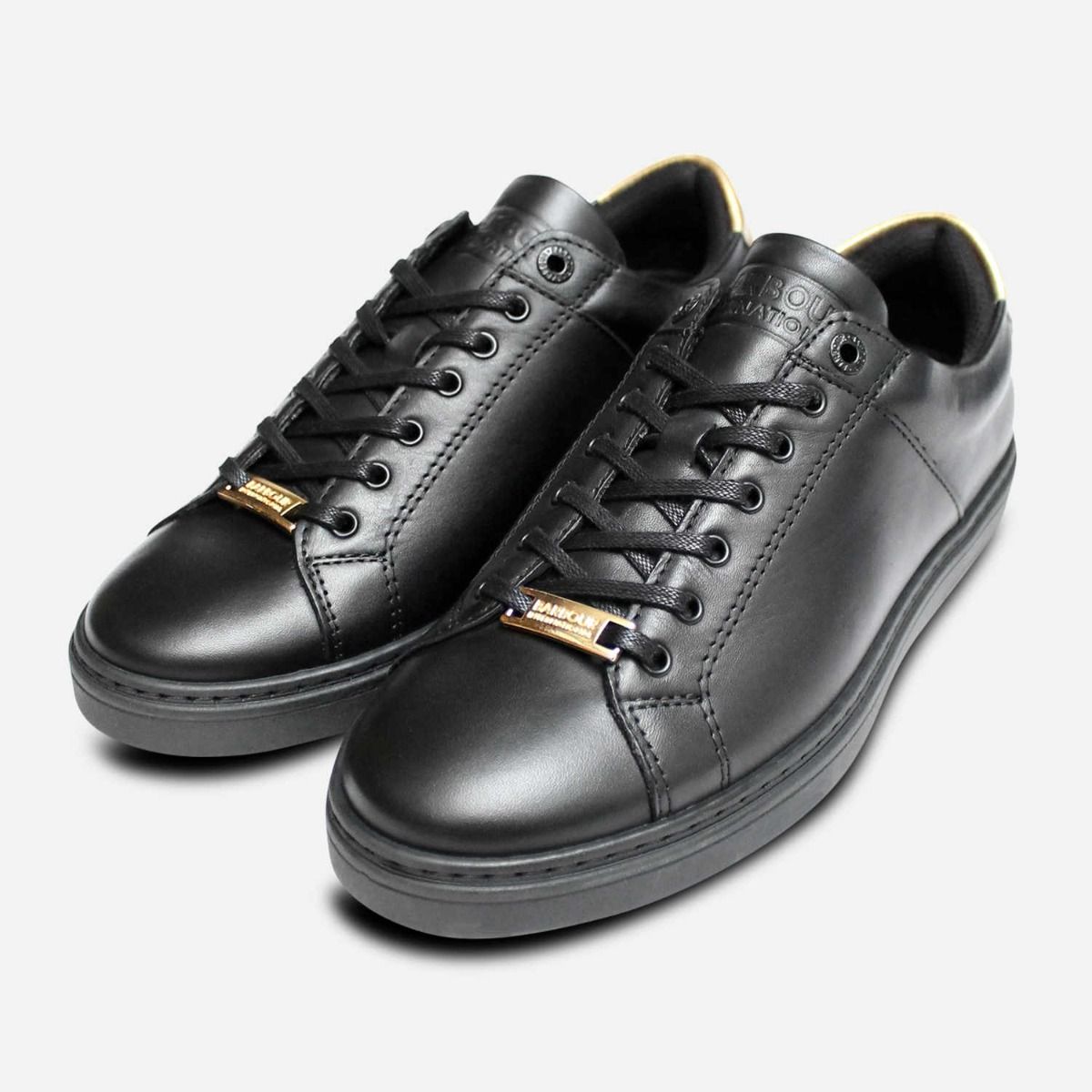 black and gold designer trainers