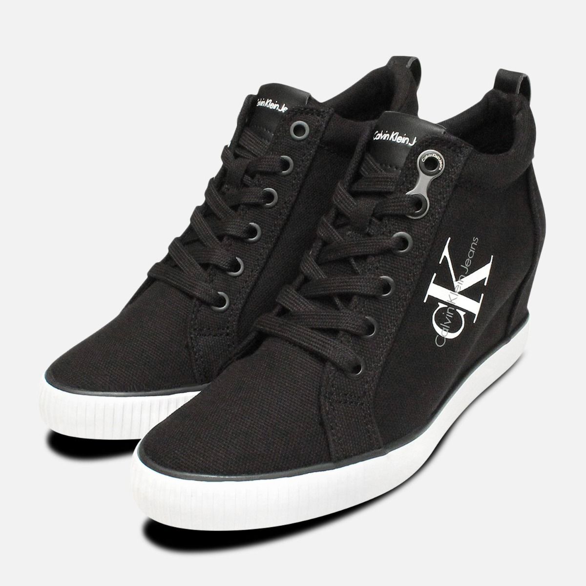 Black Canvas Ritzy Heel Sneakers by 